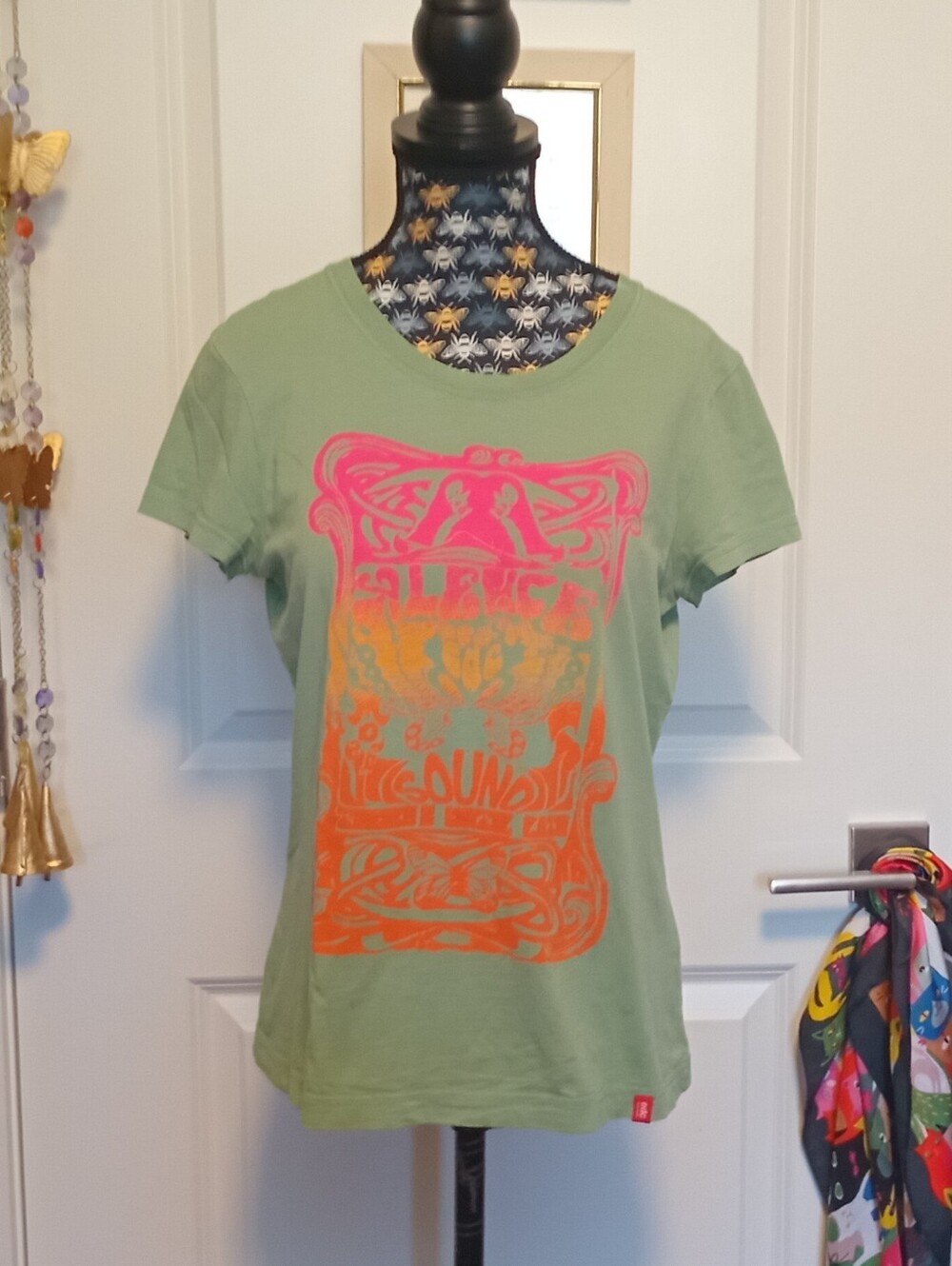 Green and pink EDC festival tee